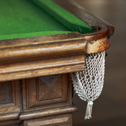 A snooker player about to pot the black