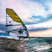 Professional windsurfer jumping a wave