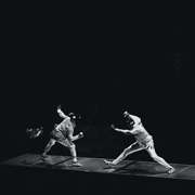 Two people fencing